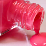 Blossom Nail Lacquer pouring out of its bottle.