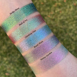 Top angled arm swatches on fair skin tone of Statue Garden Earth Vibrant Multichrome eyeshadow shifts compared to Hedge Maze, Wall of Ivy, Climbing Vine and Royal Plum