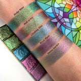 Top angled arm swatches on fair skin tone of Hedge Maze Earth Vibrant Multichrome Eyeshadow shifts compared to Wall of Ivy, Climbing Vine, Royal Plum and Statue Garden
