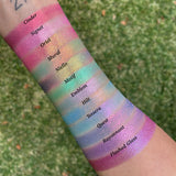 Top angled arm swatches on fair skin tone of Cinder, Signet, Oriel, Mural, Niello, Motif, Emblem, Hilt, Tessera, Quest, Rayonnant and Flashed Glass