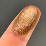 Top angled finger swatches of Caribou Shimmer Eyeshadow.