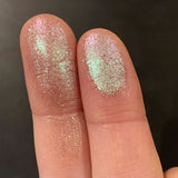 Close up finger swatches on fair skin tone of Carving Glitter Multichrome Eyeshadow