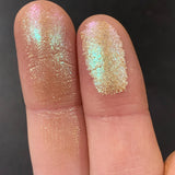 Close up finger swatches on fair skin tone of Chandelier Glitter Multichrome Eyeshadow