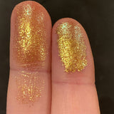 Close up finger swatches of Corrosion Glitter Multichrome Eyeshadow