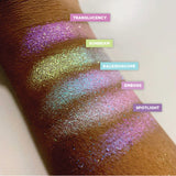 Low left angled arm swatches on deep skin tone of Translucency Glitter Multichrome Eyeshadow shifts compared to Sunbeam, Kaleidoscope, Emboss, Spotlight