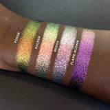 Arm swatches on deep skin tone of Redox Dimensional Multichrome Eyeshadow shifts compared to Forge, Solder and Flame-Blown