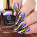 Close up of nails done with Distortion Nail Lacquer featuring a design to show off the magnetic effect on fair skin tone.