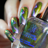 Close up of nails done with Distortion Nail Lacquer featuring a magnetic zig zig effect on fair skin tone