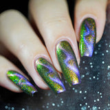 Close up of nails done with Distortion Nail Lacquer featuring a zig zag magnetic effect on fair skin tone