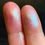 Close up finger swatches of Emboss Glitter Multichrome Eyeshadow