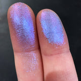 Close up finger swatches on fair skin tone od Enamel Glitter Multichrome Eyeshadow