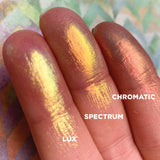 Left angled finger swatches on fair skin tone of Lux, Spectrum, Chromatic shifts