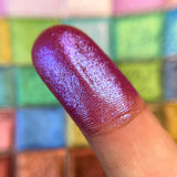 Close up finger swatches on fair skin tone of Glaziers Mark Glitter Multichrome Eyeshadow