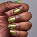 Close up of nails done with Grow Nail Lacquer on deep skin tone.