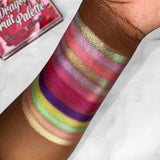 Top angled arm swatches on deep skin tone featuring shadows from The Dragon Fruit Palette