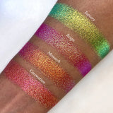Top angled arm swatches on medium skin tone of Monarch Vibrant Multichrome Eyeshadow shifts compared to Topiary, Reign and Coronation