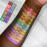 Top angled arm swatches on deep skin tone of Cinder, Signet, Oriel, Mural, Niello, Motif, Emblem, Hilt, Tessera, Quest, Rayonnant and Flashed Glass