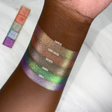 Top angled arm swatches on deep skin tone of Glitter Vibrant Multichrome Expansion Bundle (New Shades Only) featuring: Empress, Court Jester, Duchess, Diadem and Noble