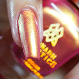 Macro shot of one nail done with Monarch Nail Lacquer on fair skin tone