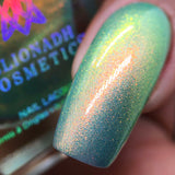 Macro shot of one nail done with Mural Nail Lacquer on medium skin tone.