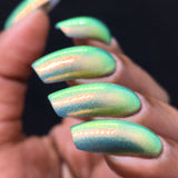 Side angled shot of nails done with Mural Nail Lacquer on medium skin tone