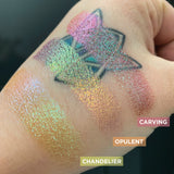 Close up hand swatches on fair skin tone of Opulent Glitter Multichrome Eyeshadow shifts compared to Carving, Chandelier
