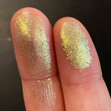 Close up finger swatches on fair skin tone of Ornamental Glitter Multichrome Eyeshadow