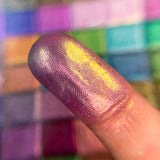 Close up finger swatch on fair skin tone of Palace Pearlescent Multichrome Pigment