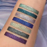Top angled arm swatches on fair skin tone of Nocturnal compared to Spruce, Necromancer, Filigree, Aqua Vitae, Narwhal and Crucible