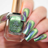 Close up of nails done with Psychonaut Nail Lacquer featuring a design to show off the magnetic effect  on fair skin tone.