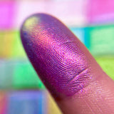 Close up finger swatch on fair skin tone of Quest Electric Multichrome Pigment