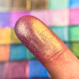 Close up finger swatch on fair skin tone of Sceptre Pearlescent Multichrome Eyeshadow