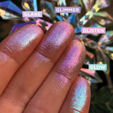 Low angled finger swatches on medium skin tone of Glow Glitter-Type Iridescent Multichrome Eyeshadow shifts compared to Glimmer, Glisten, Glare