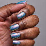 Close up shot of nails done with Squiggles Nail Lacquer on deep skin tone.