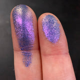 Close up finger swatches on fair skin tone of Stencil Glitter Multichrome Eyeshadow