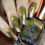 Close up of nails done with Synesthesia Nail Lacquer featuring a design to show off the magnetic effect on fair skin tone
