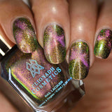 Close up of nails done with Synesthesia Nail Lacquer featuring a design to show off the magnetic effect on medium skin tone
