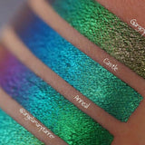 Close up arm swatches on medium skin tone of Castle Jewelled Multichrome Eyeshadow shifts compared to Gargoyle, Anneal