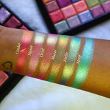 Straight angled arm swatches on medium skin tone of Niello Electric Multichrome Pigment shifts compared to Cinder, Signet, Oriel, Mural and Motif