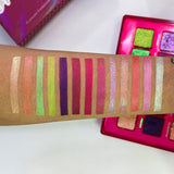 Top angled arm swatches on medium skin tone featuring shadows from the Dragon Fruit Palette