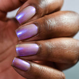 Close up of nails done with UV Nail Lacquer on deep skin tone
