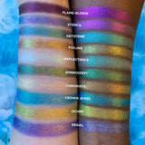 Top angled arm swatches on fair and deep skin tones of Regal Vibrant Glitter Multichrome Eyeshadow featured in Undiscovered Eyeshadow Bundle