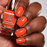 Close up of nails done with Lava Lamp nail lacquer on deep skin tone