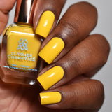 Close up of nails done with Lemonade Stand nail lacquer on deep skin tone