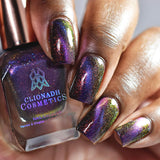 Close up of nails done with Acid Rain nail lacquer featuring a design to show off the magnetic effect on deep skin tone.