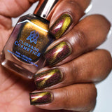 Close up of nails done with Hazard Nail Lacquer featuring a design to show off the magnetic effect on deep skin tone