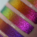 Close up right angled arm swatches on fair skin tone of Smoulder Jewelled Multichrome Eyeshadow shifts compared to Kiln, Gothic