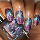 Close up of nails done with Warped nail lacquer featuring a design to show off the magnetic effect on medium skin tone.