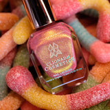 Wiggles Nail Lacquer on top of sour gummy worms.