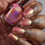 Close up shot of nails done with Wiggles Nail Lacquer on deep skin tone.